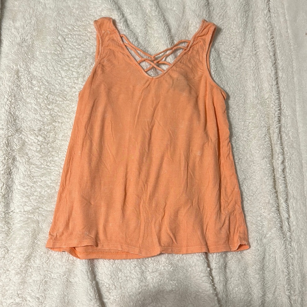 Medium size Rue 21 orange tank top, super cute! Cross straps on front and back.